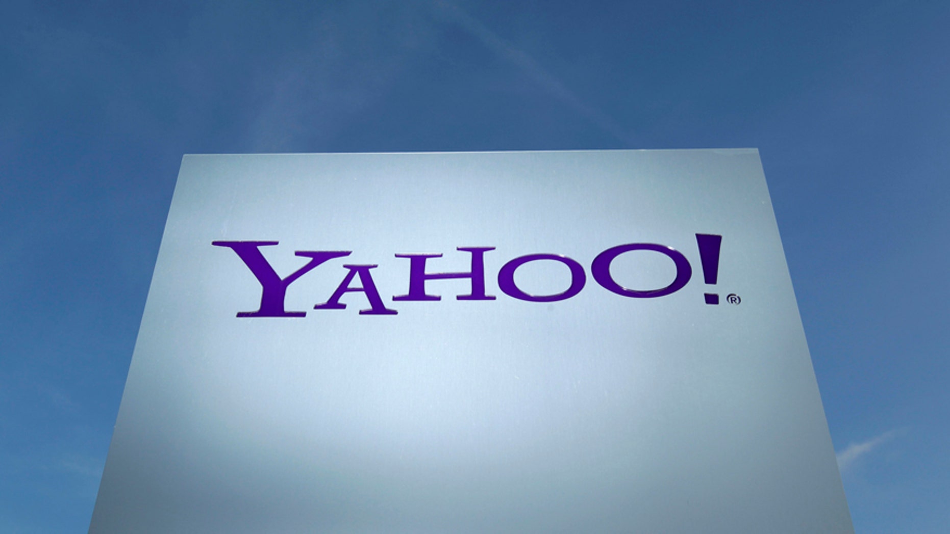 A Yahoo logo is pictured in front of a building in Rolle, 30 km (19 miles) east of Geneva, in this file picture taken December 12, 2012. Yahoo! Inc is shifting its main European tax base to Ireland from Switzerland, a Reuters examination of company statements and accounts shows, as pressure mounts on the Alpine nation to abolish some corporate tax incentives. Picture taken December 12, 2012. REUTERS/Denis Balibouse (SWITZERLAND - Tags: BUSINESS POLITICS LOGO) - RTX18CHS