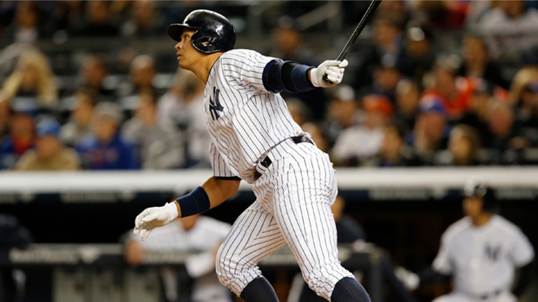 New York Yankees designated hitter Alex Rodriguez (13) hits a first-inning solo home run in a baseball game against the New York Mets at Yankee Stadium in New York, Sunday, April 26, 2015. Rodriguez now stands at 659 career home runs and needs one more to tie Willie Mays. (AP Photo/Kathy Willens)