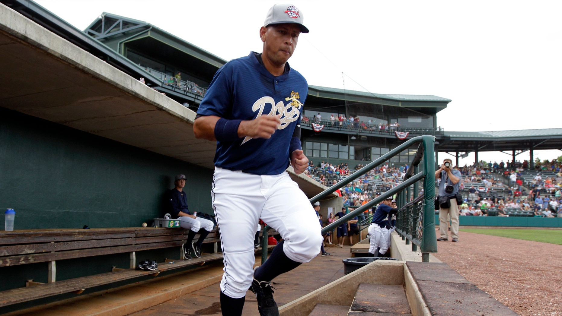 New York Yankees third baseman Alex Rodriguez takes the field during the first inning in his first rehab baseball game with the Charleston RiverDogs, against the Rome Braves in Charleston, S.C., Tuesday, July 2, 2013. (AP Photo/Chuck Burton)