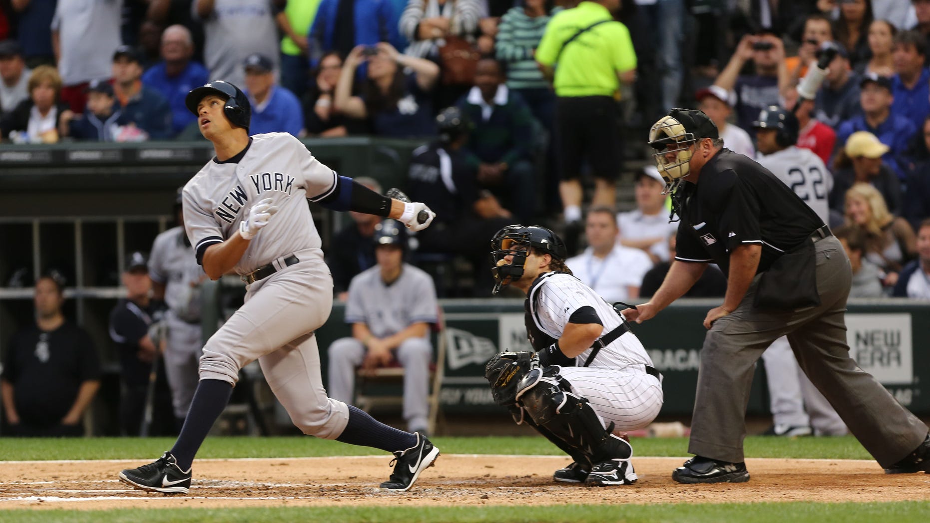 New York Yankees' Alex Rodriguez, left, gets a hit in his first at bat against the Chicago White Sox in the first inning in a baseball game at US Cellular Field, Monday, Aug. 5, 2013, in Chicago. He was suspended through 2014 when Major League Baseball disciplined 13 players in a drug case, the most sweeping punishment since the Black Sox scandal nearly a century ago. (AP Photo/Charles Cherney)