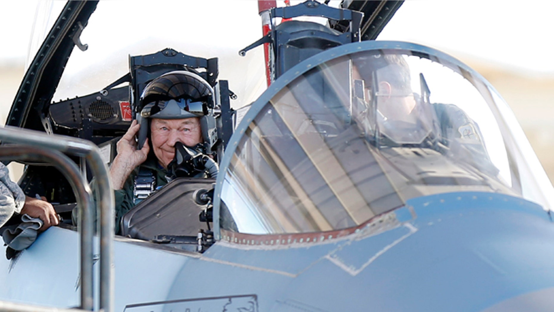 Oct. 14: Retired Air Force Brig. Gen. Charles Yeager straps into an F-15D for a re-enactment flight commemorating his breaking of the sound barrier 65 years ago at Nellis Air Force Base, Nev.