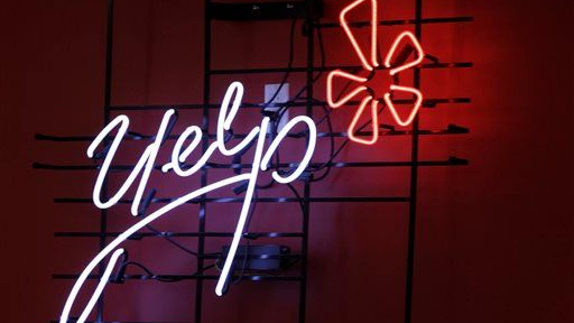 The logo of the online reviews website Yelp on a wall at the company's offices in New York.