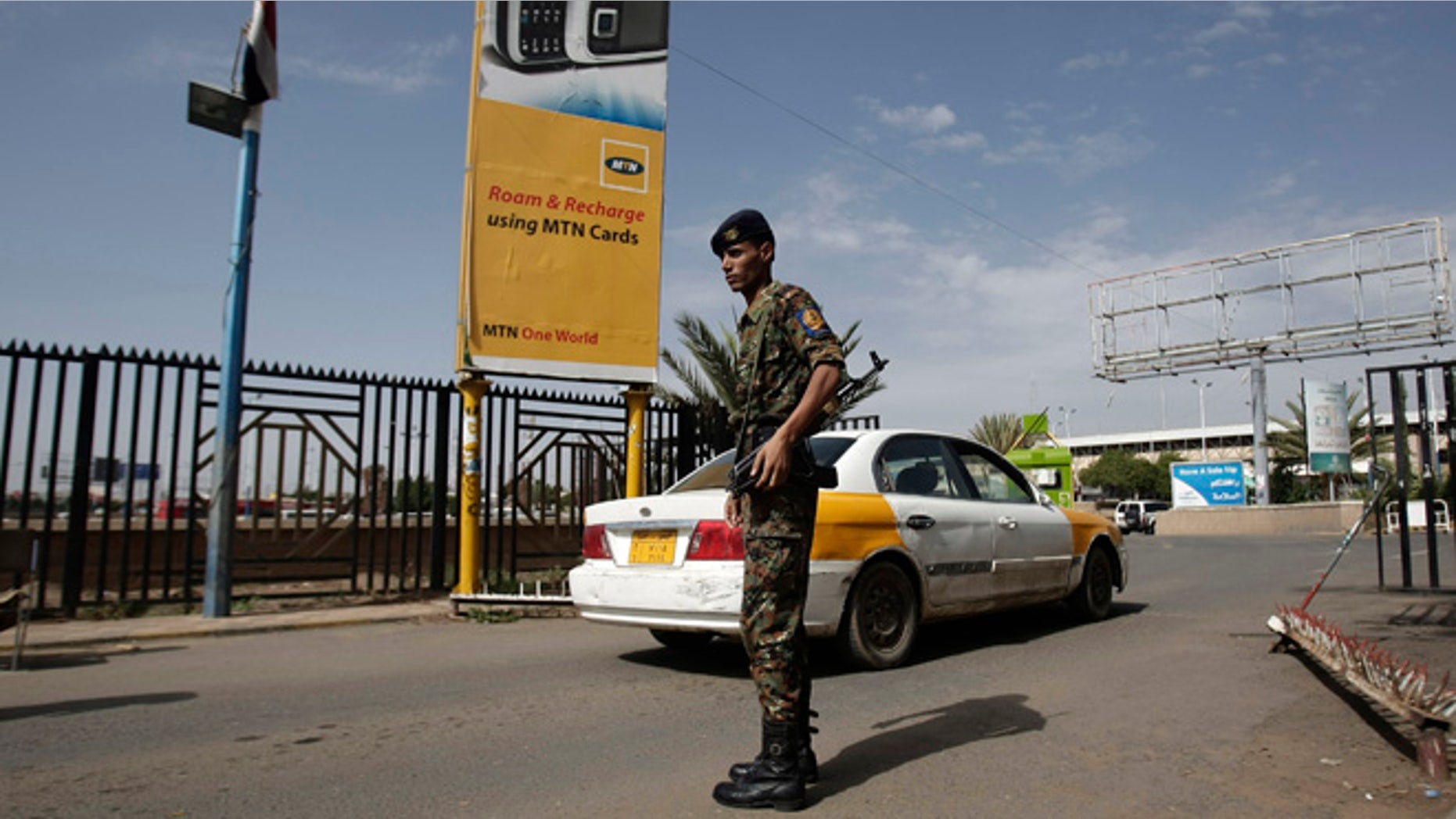 Aug. 7, 2013: A policeman stands guard at the entrance of Sanaa International Airport, Yemen.