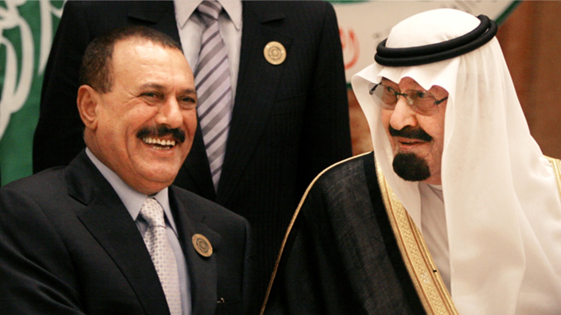 FILE - In this March 27, 2007 file photo, Saudi King Abdullah bin Abd al-Aziz, right, shakes hands with Yemeni President Ali Abdullah Saleh before the Arab summit in Riyadh, Saudi Arabia. King Abdullah has mediated a one-week cease-fire in Yemen between the warring forces of President Ali Abdullah Saleh and the anti-government opposition, following an attack on Saleh's presidential palace compound in Sanaa, Yemen, Friday, June 3, 2011.