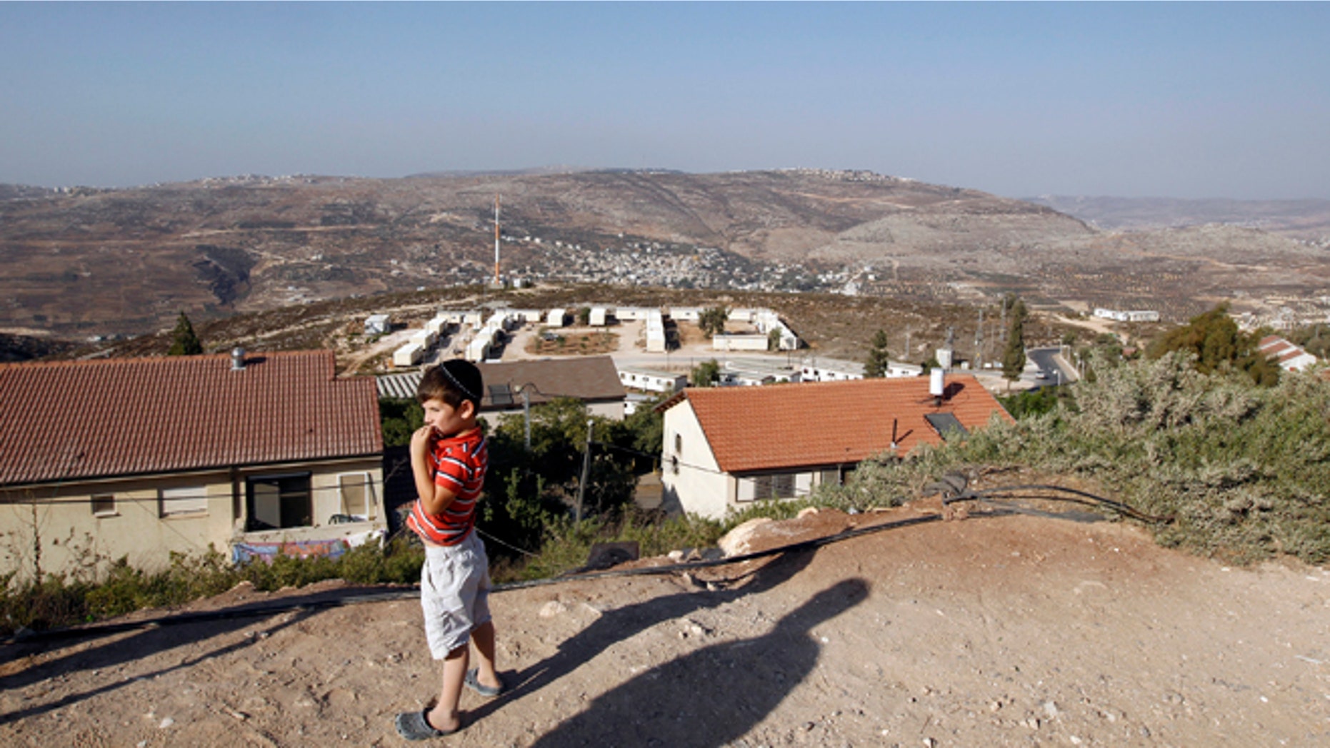 Sept. 20, 2010: A boy stands in the West Bank Jewish settlement of Yitzhar, south of Nablus.