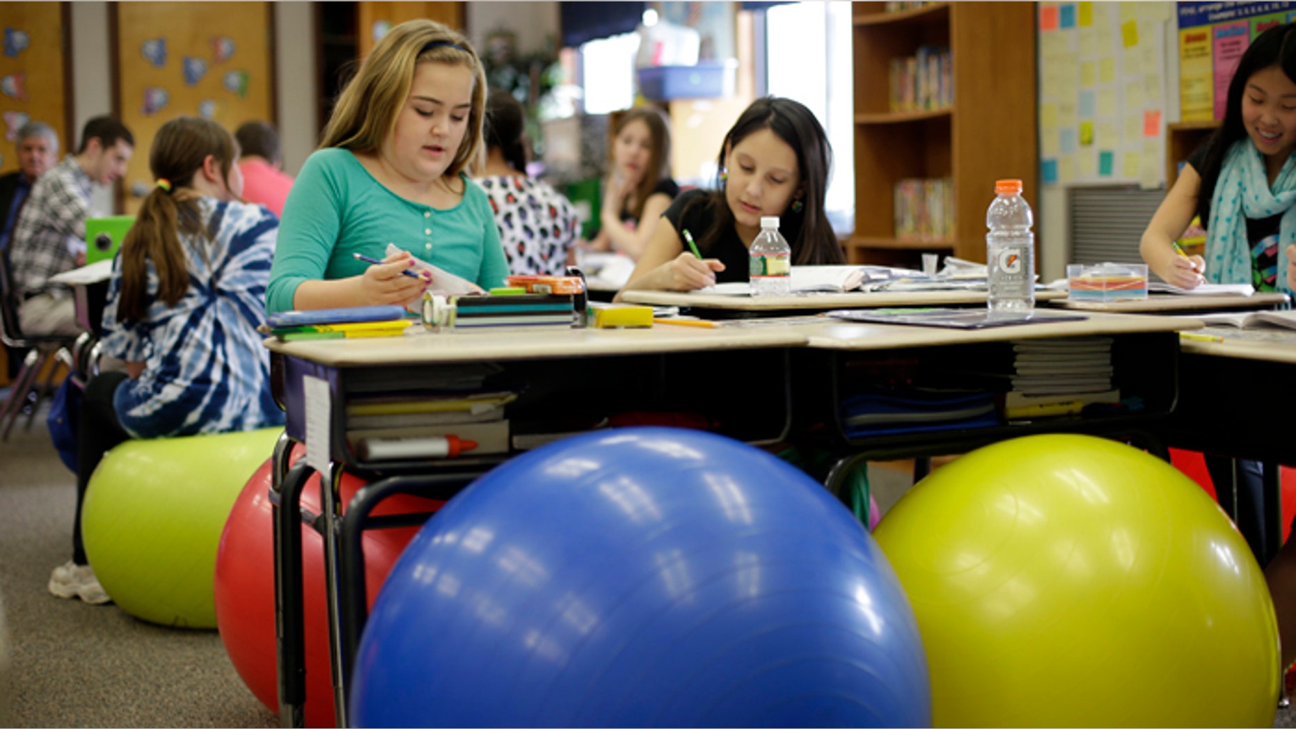 Students in Robbi Giuliano's fifth grade class sit on yoga balls as they complete their assignments at Westtown-Thornbury Elementary School.