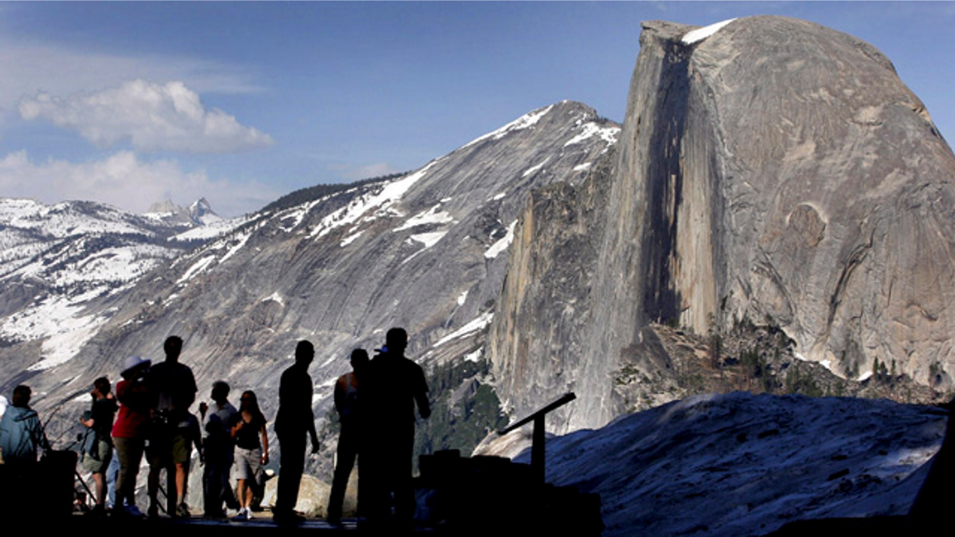FILE - In this 2005 file photo, visitors view Half Dome from Glacier Point at Yosemite National Park, Calif. (AP Photo/Dino Vournas, File)
