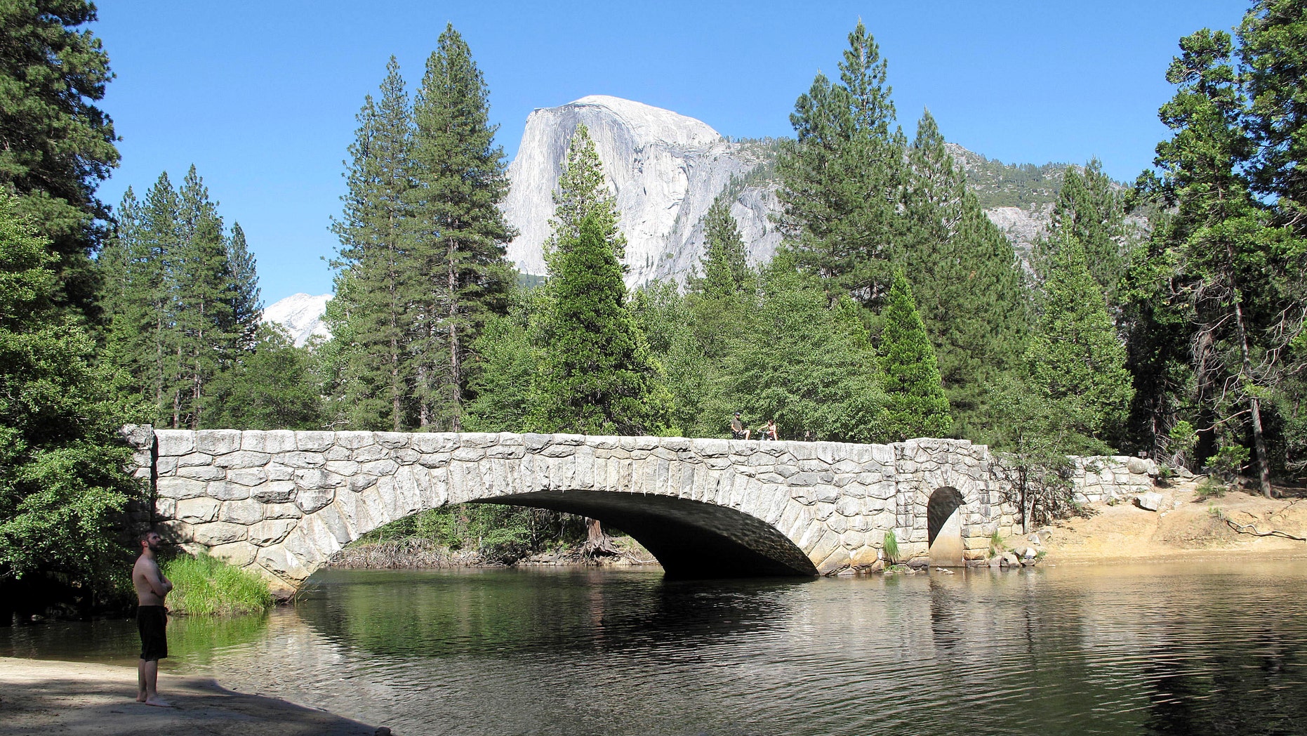 June 12, 2012: This photo shows Yosemite National Park's Stoneman Bridge, a single, arching span faced with rough-hewn granite, provides a dramatic foreground to Half Dome, the park's most iconic feature.