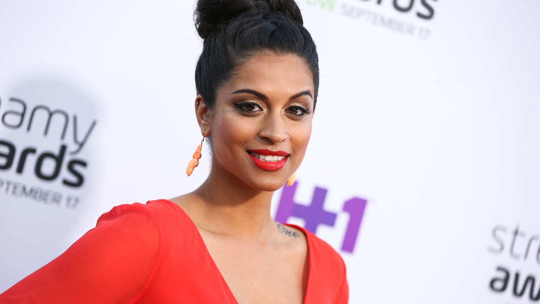 FILE - In this Sept. 17, 2015 file photo, Lilly Singh arrives at the 5th Annual Streamy Awards at the Hollywood Palladium in Los Angeles. "Lazer Team" was the most funded original film in Indiegogos history, and it's been selling out hundreds of theaters for fan screenings since Jan. 27, 2016. In addition to "Lazer Team," YouTube Originals is launching with a documentary profiling YouTube comedienne Lilly "Superwoman" Singh embarking on a world tour, the dance flick "Dance Camp" starring young Internet personalities and a reality series centering on top YouTuber Felix "PewDiePie" Kjellberg living out his nightmares. (Photo by Rich Fury/Invision/AP, File)