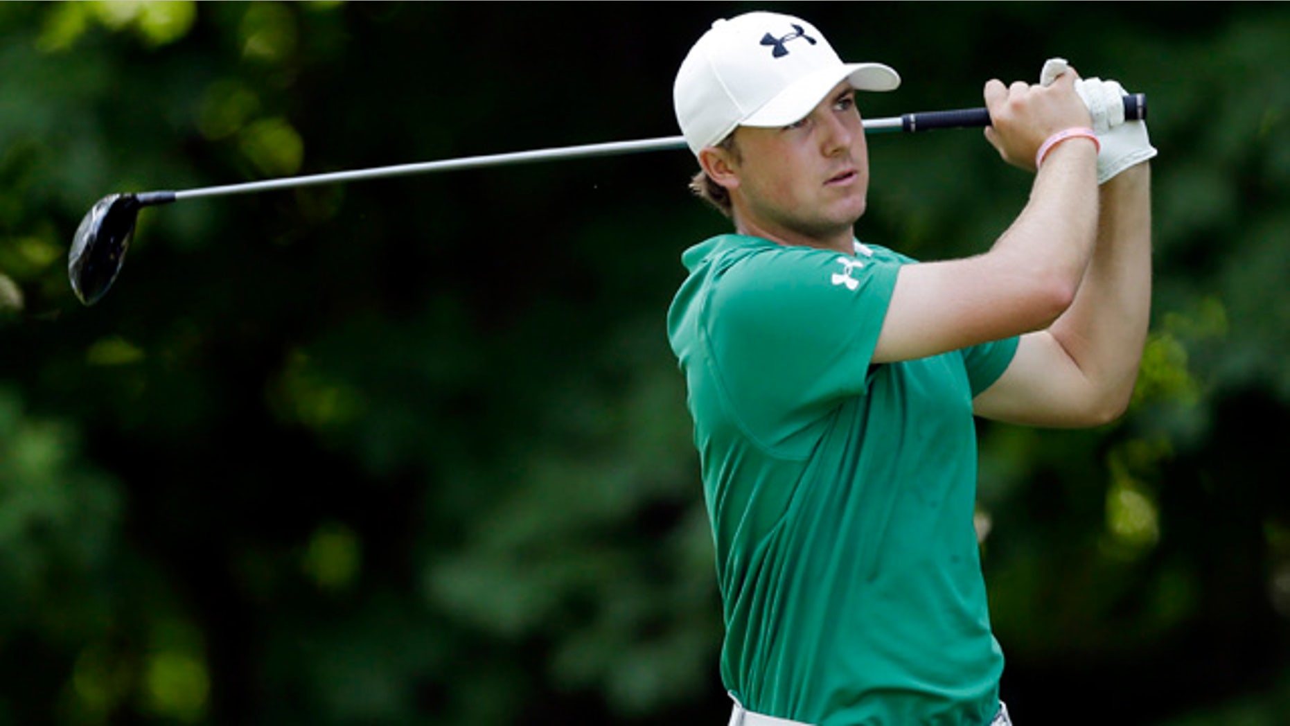 July 14, 2013: Jordan Spieth hits off the 17th green during the final round of the John Deere Classic golf tournament.