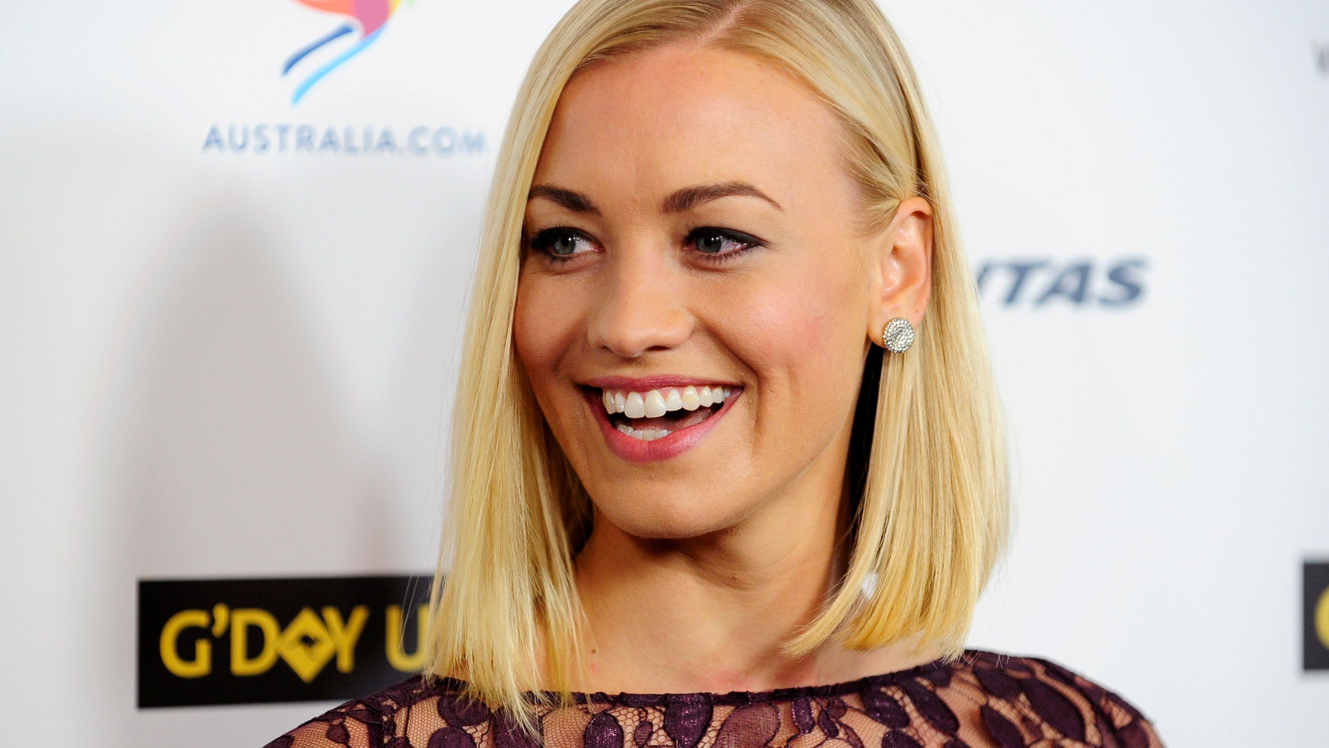 Australian actress Yvonne Strahovski arrives during the G'Day USA Black Tie Gala in Los Angeles, California, January 11, 2014.