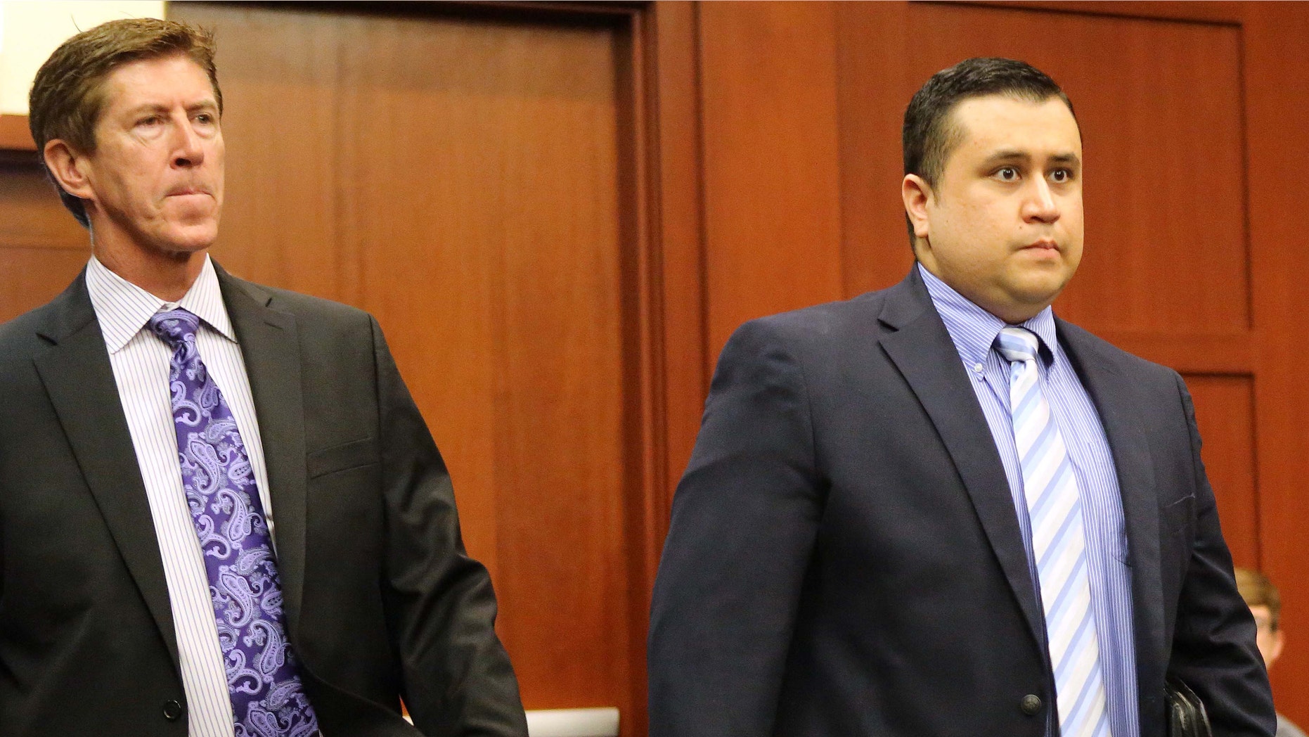 George Zimmerman, right, arrives with his lead counsel, Mark O'Mara, for a hearing in Seminole circuit court, in Sanford, Fla., Tuesday, Feb. 5, 2013. Zimmerman's attorneys presented a motion Tuesday asking Judge Debra Nelson to push the trial from mid-June back to November, but she denied the defense request to delay the trial. Zimmerman is accused of shooting Florida teenager Trayvon Martin last year. He has pleaded not guilty to second-degree murder charges. (AP Photo/Orlando Sentinel, Joe Burbank, Pool)