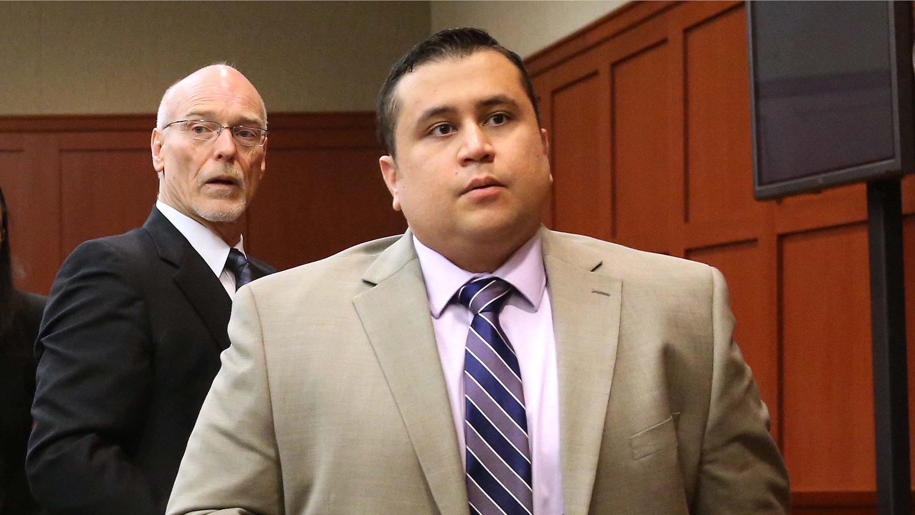 FILE - George Zimmerman, right, and attorney Don West, stand as the judge enters the courtroom in Seminole circuit court for a pretrial hearing, in Sanford, Fla., in this Saturday, June 8, 2013 file photo. Jury selection begins Monday June 10, 2013 in the second-degree murder trial, which is expected to last about six weeks. Martin's killing drew worldwide attention as it sparked a national debate about race, equal justice under the law and gun control. (AP Photo/Orlando Sentinel, Joe Burbank, Pool)