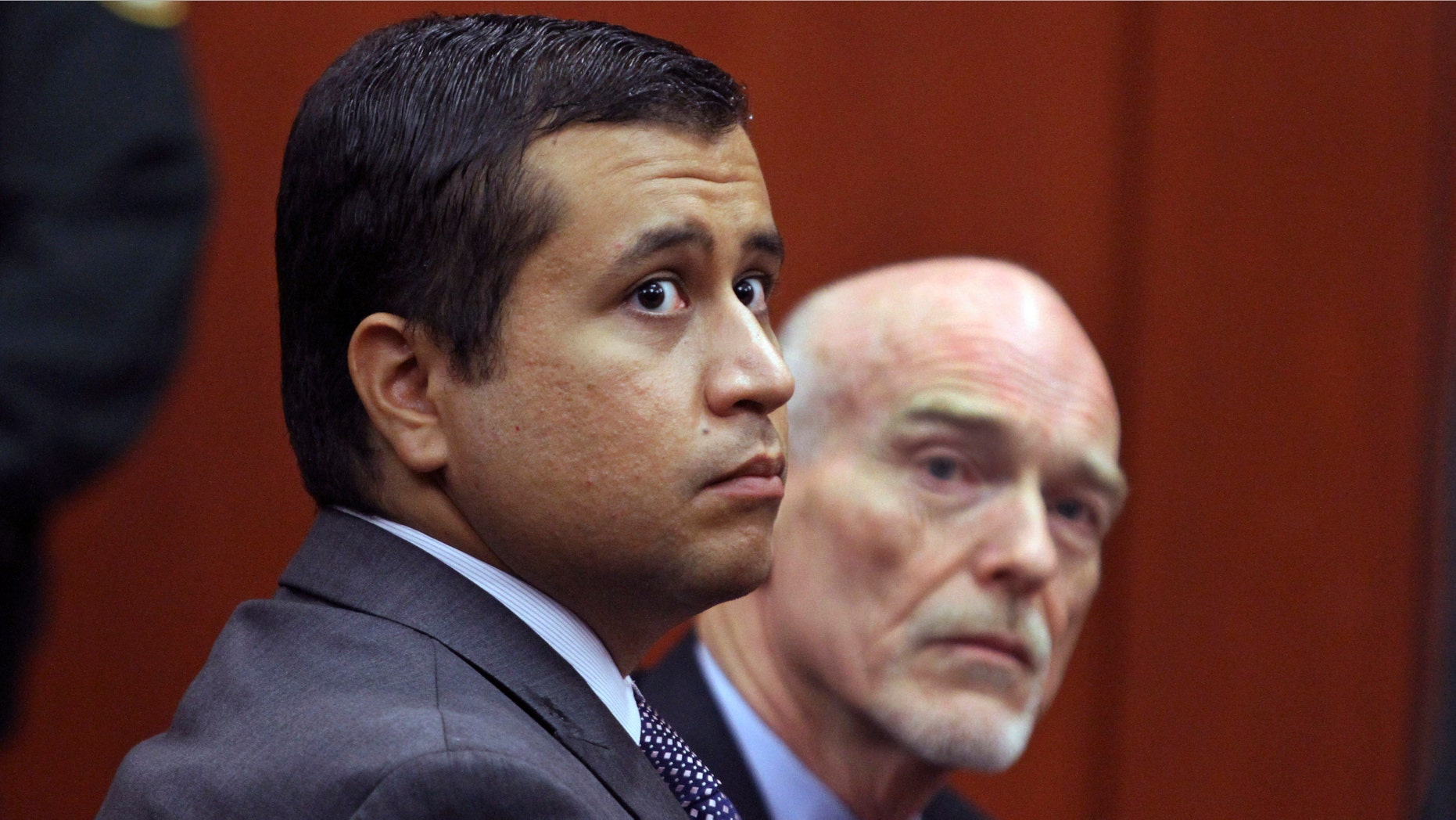 FILE - In this June 29, 2012 file photo, George Zimmerman, left, and attorney Don West appear before Circuit Judge Kenneth R. Lester, Jr. Friday, June 29, 2012, during a bond hearing at the Seminole County Criminal Justice Center in Sanford, Fla. Zimmerman will try to have the murder charge dismissed under Florida's "stand your ground" self-defense law, his attorney said Thursday, Aug. 9, 2012. Zimmerman is charged with second-degree murder in the shooting of Trayvon Martin.(AP Photo/Orlando Sentinel, Joe Burbank, Pool)