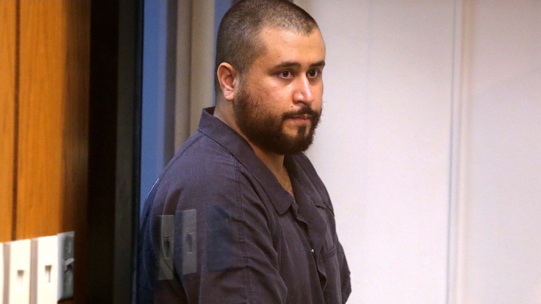 George Zimmerman, acquitted in the high-profile killing of unarmed black teenager Trayvon Martin, listens in court Tuesday, Nov. 19, 2013, in Sanford, Fla., during his hearing on charges including aggravated assault stemming from a fight with his girlfriend. (AP Photo/Orlando Sentinel, Joe Burbank, Pool)