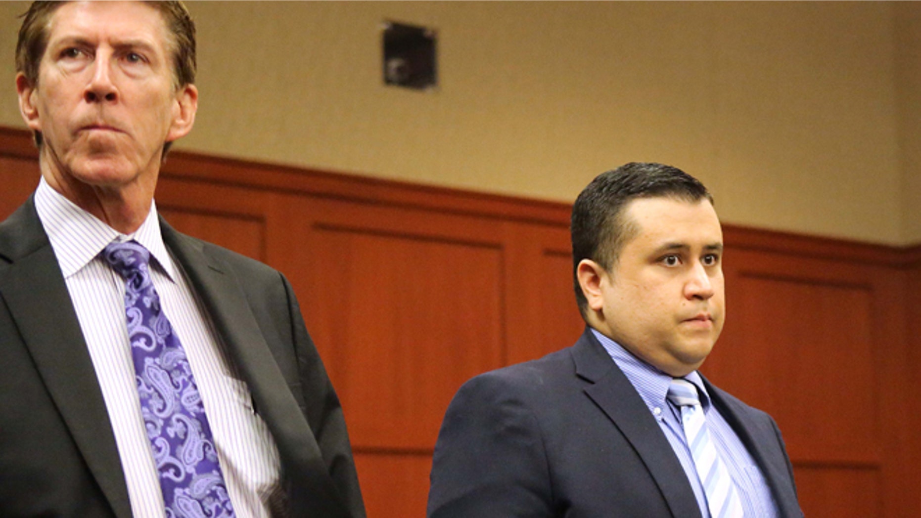 Feb. 5: George Zimmerman, right, wears a bulletproof vest in public, Mark O'Mara, left, his attorney, says.