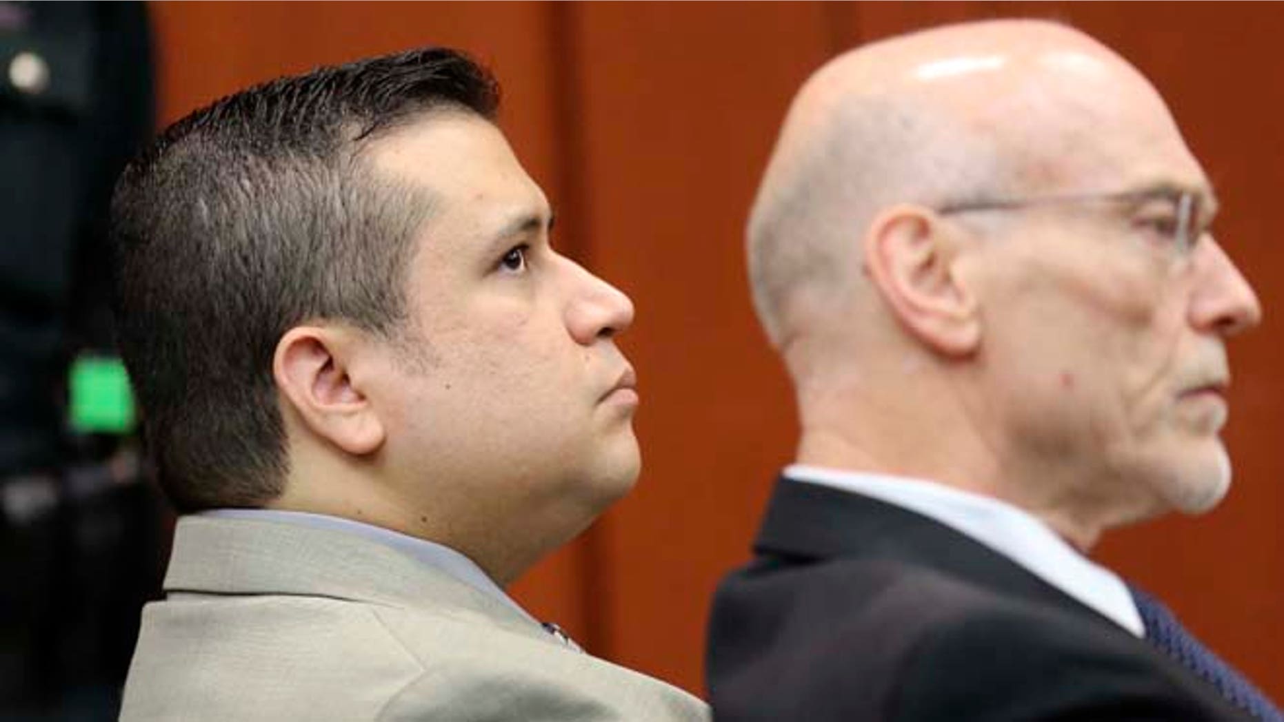 June 6, 2013: George Zimmerman, left, sits in Seminole circuit court with co-counsel Don West, during a pre-trial hearing, in Sanford, Fla. (AP/Pool/Orlando Sentinel)