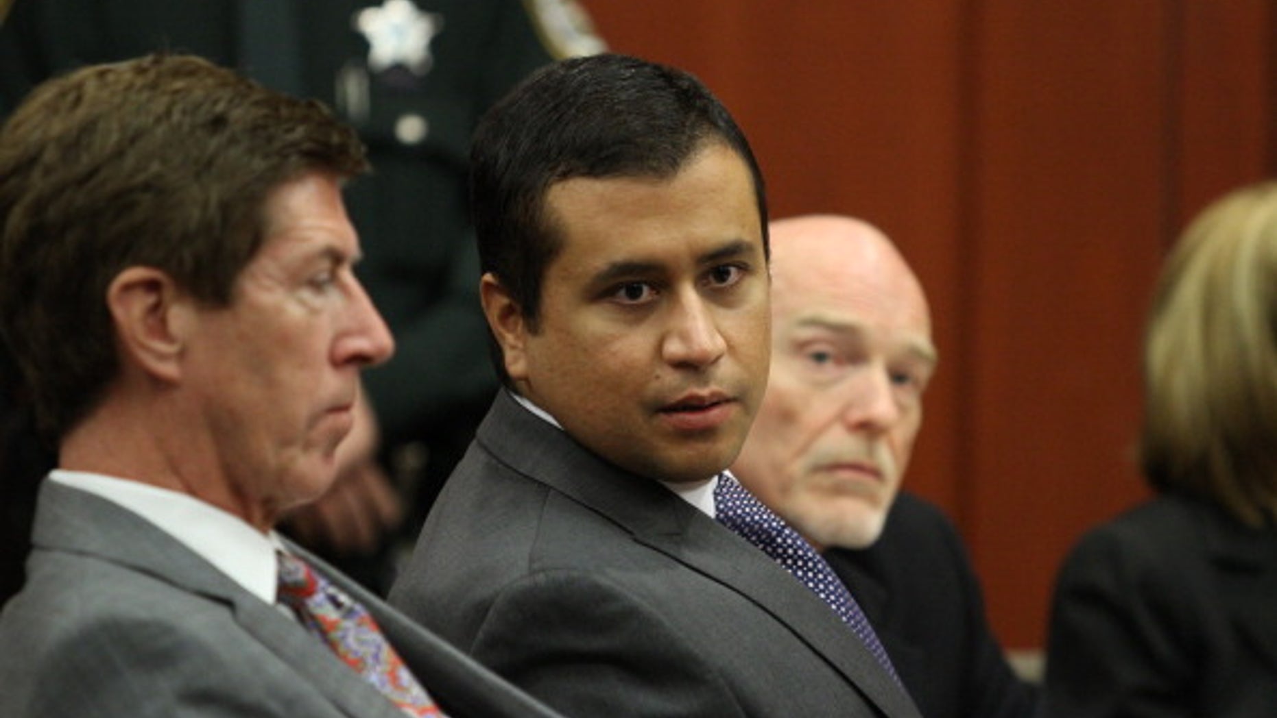 George Zimmerman (C) sits during his bond hearing with his attorney in a Seminole County courtroom in Sanford, Florida. Zimmerman is charged with second degree murder in the shooting death of Trayvon Martin.