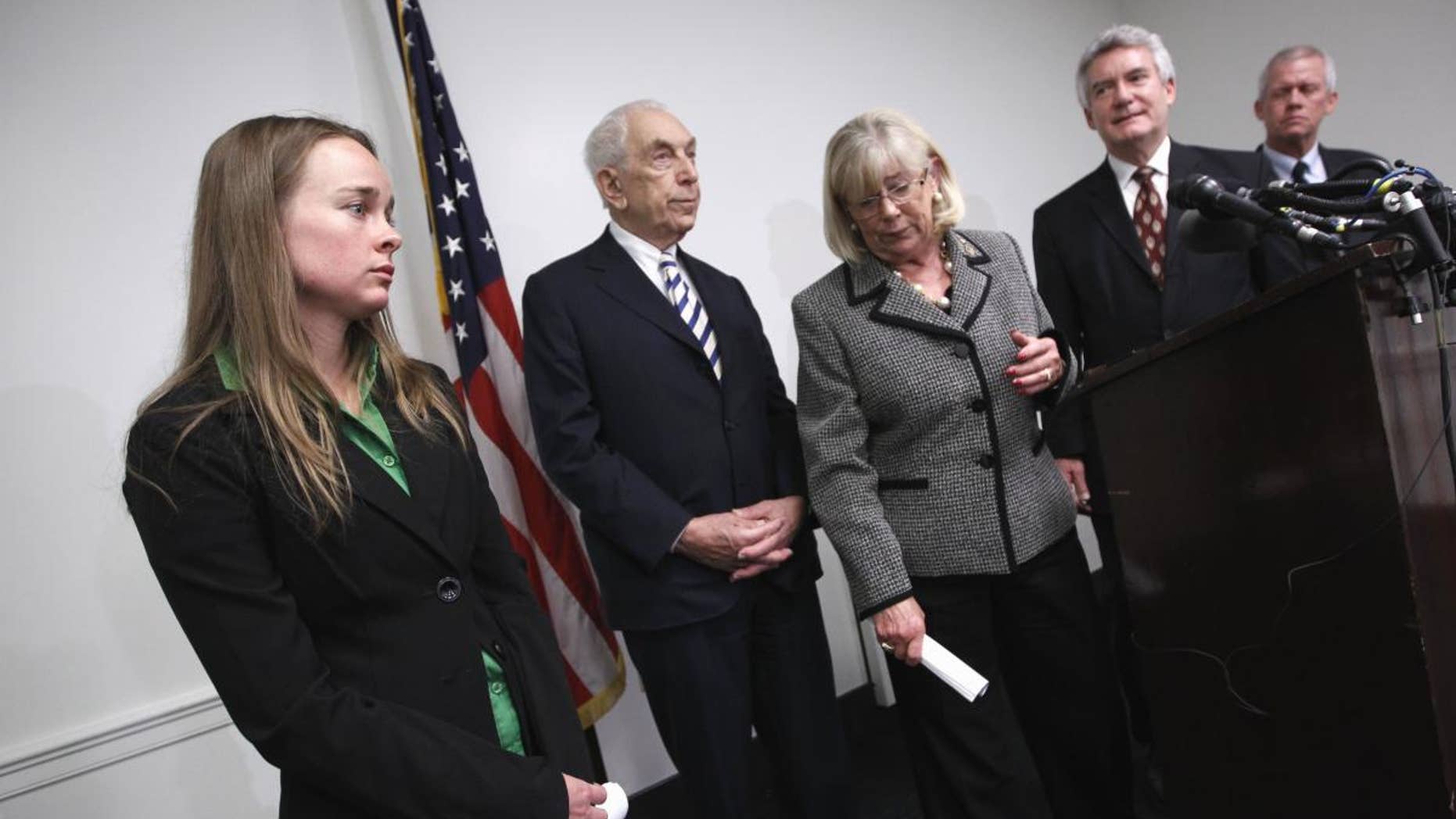 Kelly O'Brien, fiance of Congressional staffer Gabe Zimmerman who was killed in the shooting rampage in Tucson, Ariz., left, attends a news conference on Capitol Hill in Washington, Tuesday, April 12, 2011, to endorse legislation to ban large-capacity ammunition magazines. From left are, O'Brien, Sen. Frank Lautenberg, D-N.J., Rep. Carolyn McCarthy, D-N.Y., Paul Helmke, president of the Brady Campaign, and Ross Zimmerman, father of shooting victim Gabe Zimmerman. (AP Photo/J. Scott Applewhite)