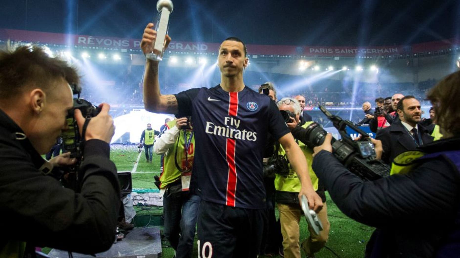 PARIS, FRANCE - MAY 14: Paris Saint-Germain's Swedish forward Zlatan Ibrahimovic holds the trophy after winning the French L1 title at the end of the French L1 football match between Paris Saint-Germain (PSG) vs Nantes on May 14, 2016 at the Parc des Princes stadium in Paris, France. (Photo by Geoffroy Van der Hasselt/Anadolu Agency/Getty Images)