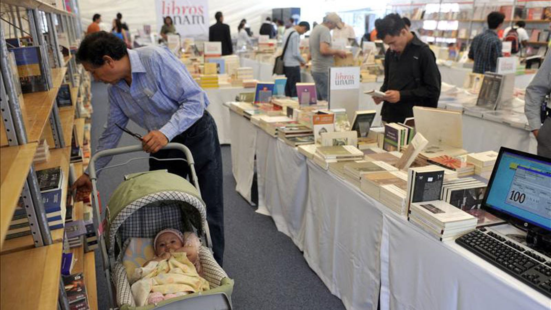 Visitors browse the offerings on Oct. 19 at the 12th Zocalo International Book Fair in Mexico City.