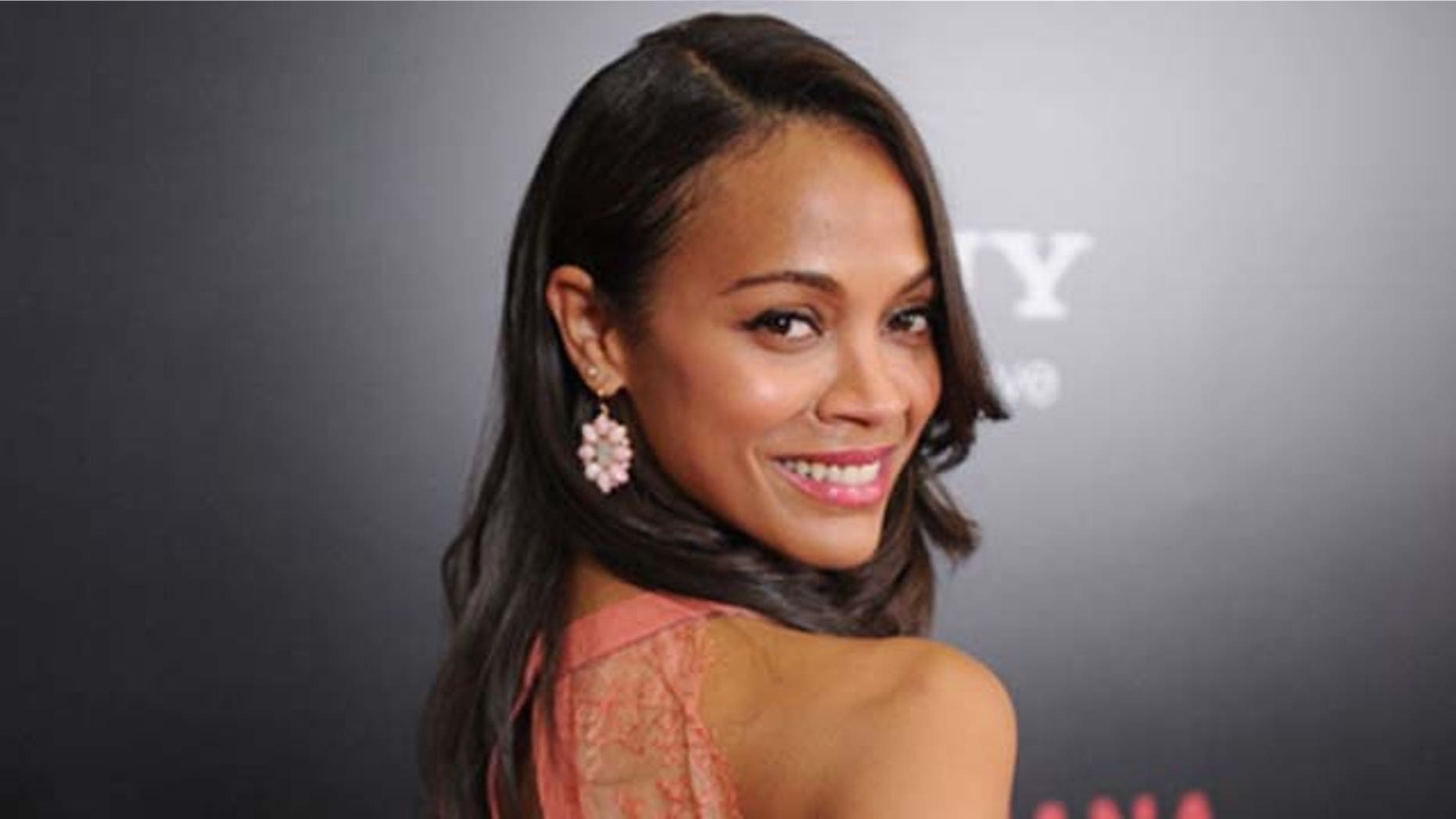August 24, 2011: Actress Zoe Saldaña arrives at the screening of ' 'Colombiana' in Los Angeles, Calif.