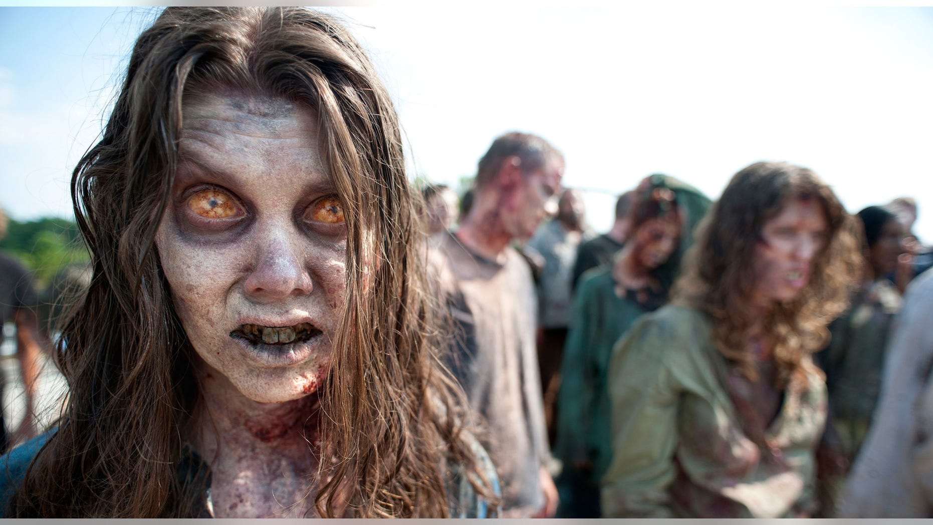 In this image released by AMC, zombies appear in a scene from the second season of the AMC original series, "The Walking Dead" in Senoia, Ga.
