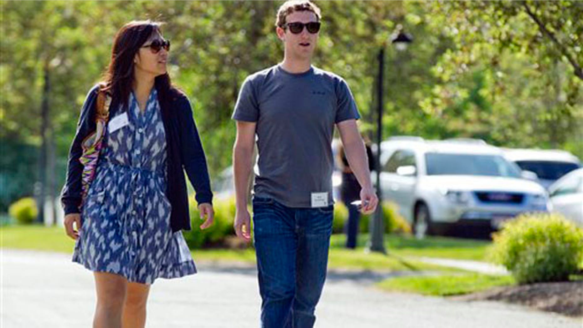 In this July 9, 2011, file photo, Mark Zuckerberg, president and CEO of Facebook, walks with Priscilla Chan during the 2011 Allen and Co. Sun Valley Conference, in Sun Valley, Idaho. Zuckerberg and his wife, Chan, were the most generous American philanthropists in 2013, The Chronicle of Philanthropy reported, Monday, Feb. 10, 2014, with a donation of 18 million Facebook shares, valued at more than $970 million, given to a Silicon Valley nonprofit in December. (AP)