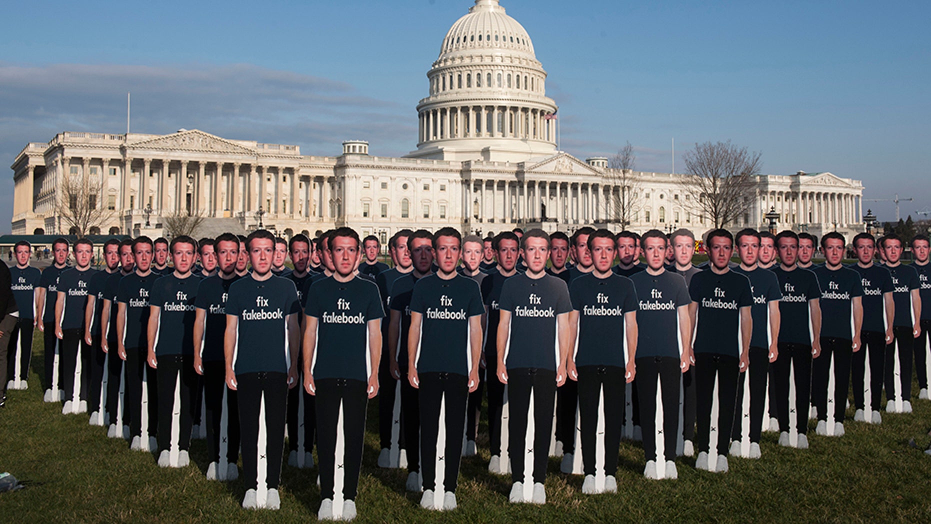 While Mark Zuckerberg prepares to testify before the Senate, 100 cardboard cutouts of the Facebook founder and CEO stand outside the U.S. Capitol in Washington on Tuesday, April 10, 2018.