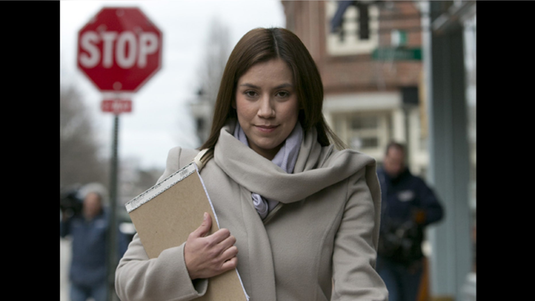 In this March 13, 2013 file photo, Alexis Wright, 30, leaves the Cumberland County Courthouse in Portland, Maine. Wright, a Zumba fitness instructor who pleaded guilty to using her Maine studio as a front for prostitution.