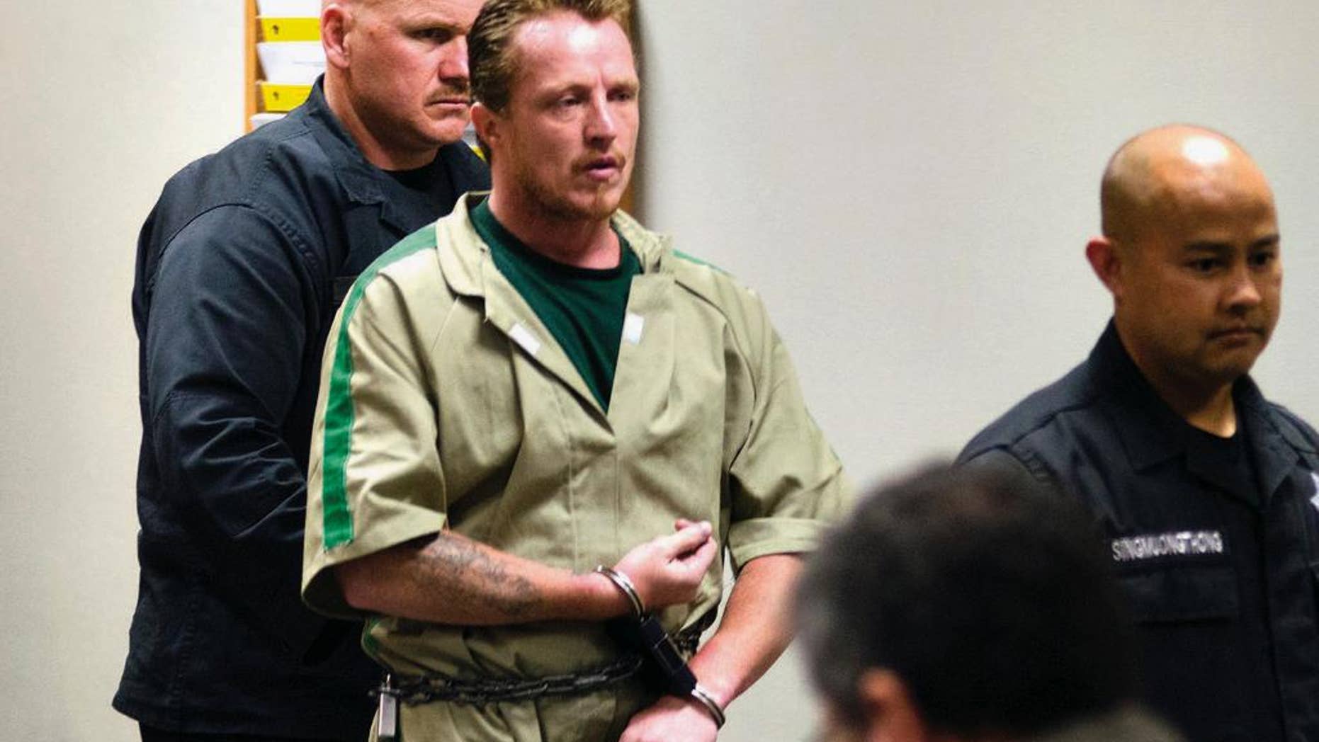 Aug. 11, 2014: In this file photo, Nicholas Sheley is escorted into the Whiteside County courtroom in Morrison, Ill., for sentencing in the murder of four people in a northwest Illinois apartment in the June 2008.
