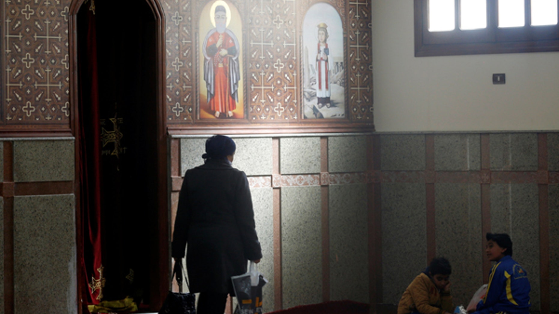 A Christian family from Al-Arish city takes a rest after arriving inside the Saint Church in Ismailia, northeast of Cairo, Egypt.