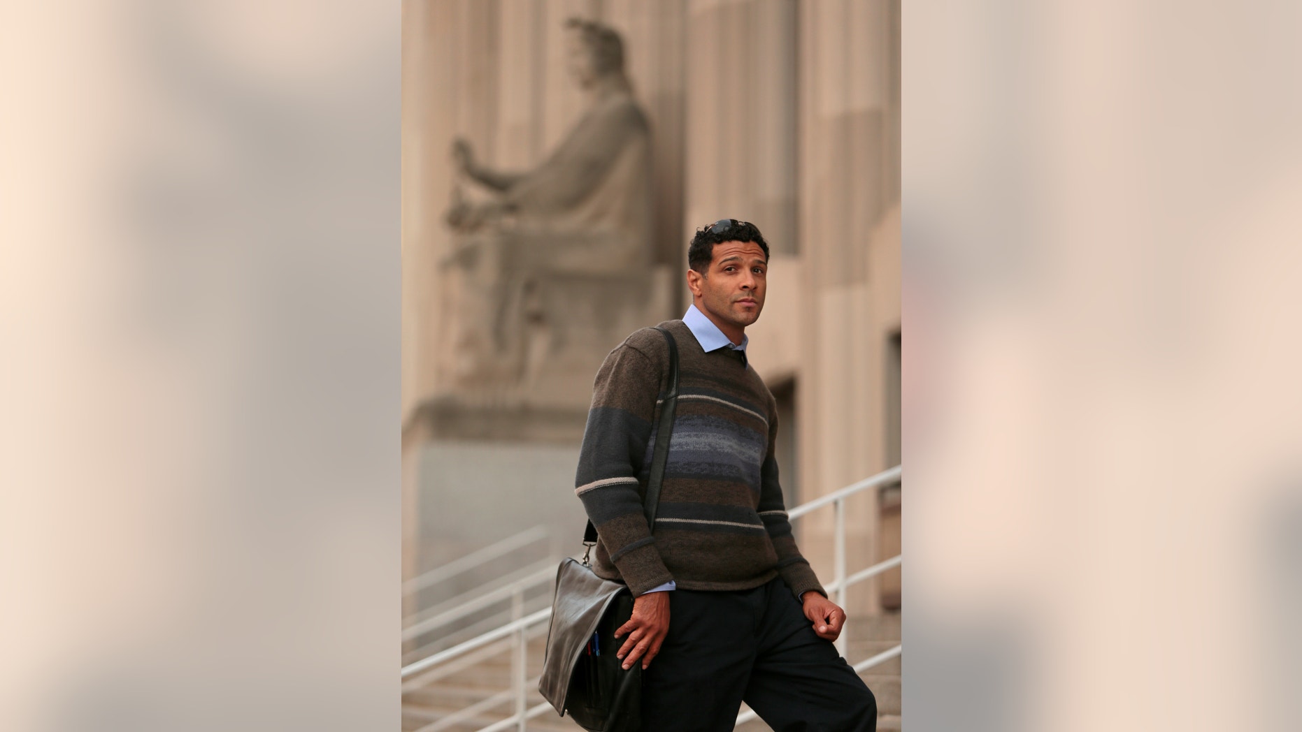 Dan Scott stands outside the the city St. Louis courthouse on Thursday, Nov. 14, 2013. Scott, a St. Louis community activist barred from his home for nearly two years while facing criminal harassment charges, will learn durimg a sentencing hearing Friday, Jan. 10, 2014 whether he’ll go to jail. Scott was found guilty in November of one count of misdemeanor harassment but not guilty of six other charges. (AP Photo/St. Louis Post-Dispatch, David Carson) EDWARDSVILLE INTELLIGENCER OUT; THE ALTON TELEGRAPH OUT