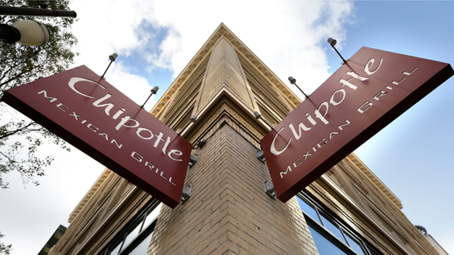 Signage hangs from a closed Chipotle restaurant in Portland, Ore., Monday, Nov. 2, 2015. Chipotle voluntarily closed down 43 of its locations in Washington and the Portland area as a precaution after an E. coli outbreak linked to six of its restaurants in the two states has sickened nearly two dozen people. (AP Photo/Don Ryan)