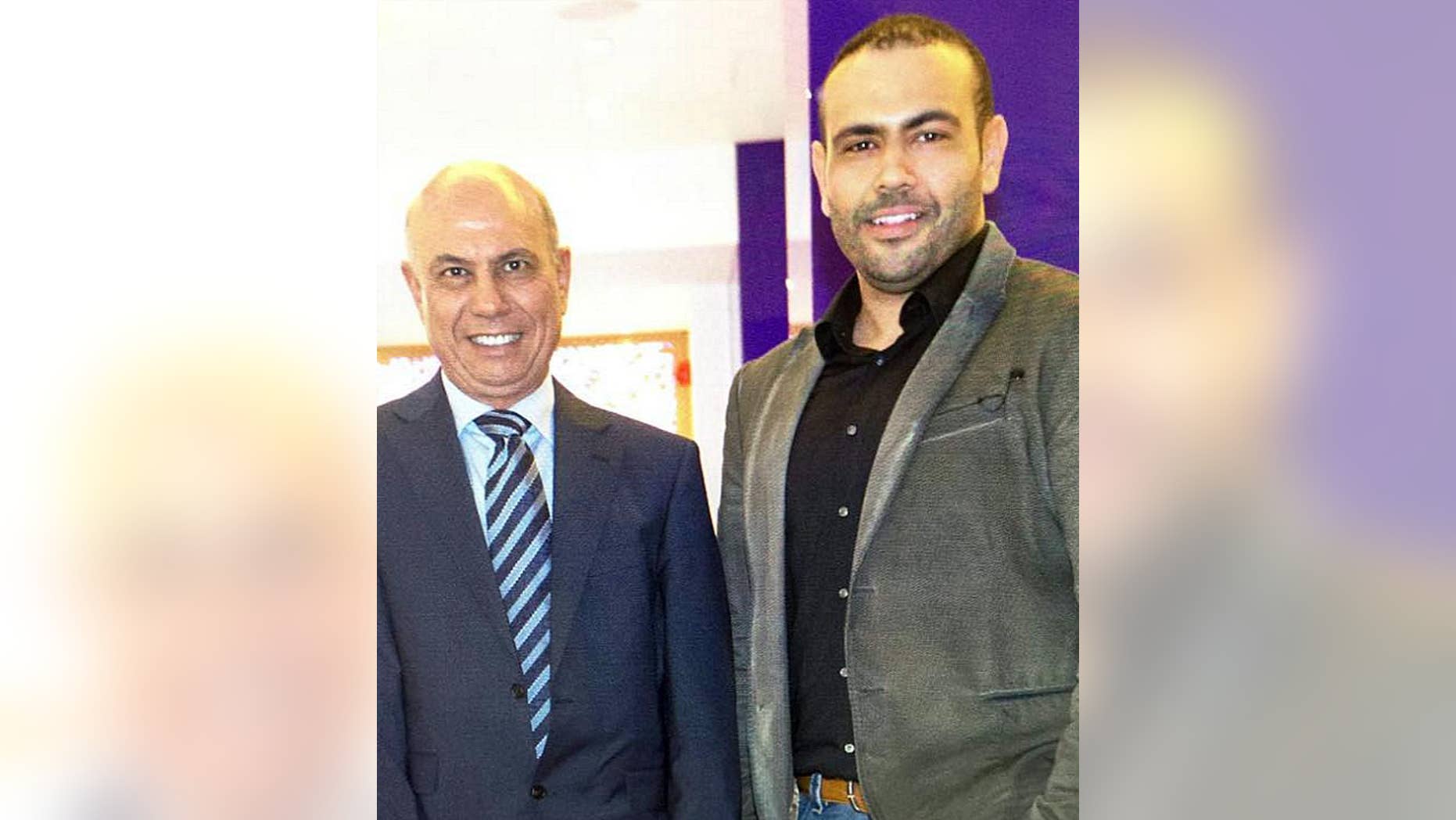 FILE- This undated file photo made available by Amal Eldarat, a family relative, shows Kamal Eldarat, left, and his son Mohammed Eldarat. The Two Libyan Americans, detained in the United Arab Emirates since August 2014, have been acquitted of charges they illegally raised funds for a foreign entity on Monday, May 30, 2016. The defendants said they only raised money for humanitarian supplies for Libya's internationally-backed authorities with documented approval from the UAE government. They said they were tortured while in detention. (Amal Eldarat via AP, File)