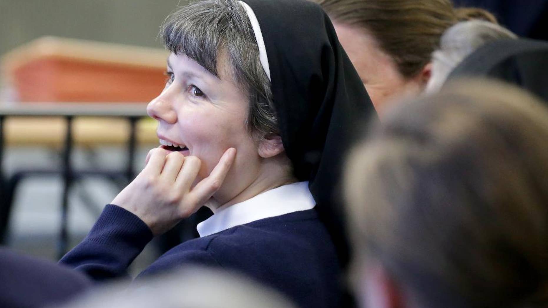 Kimberly Miller, a Philadelphia nun and teacher at Little Flower High School for Girls in the city, looks on before appearing in Washington Township Municipal Court, in Washington Township, N.J., Wednesday, April 13, 2016. Miller has been charged with driving under the influence and related charges. (Tim Hawk/NJ.com via AP, Pool)