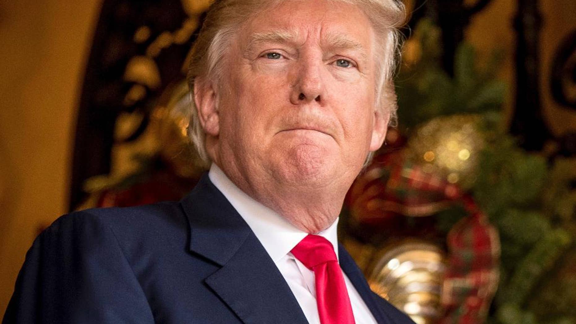 President-elect Donald Trump takes a question from a member of the media at Mar-a-Lago, in Palm Beach, Fla., Wednesday, Dec. 21, 2016. Trump on Thursday abruptly called for the United States to “greatly strengthen and expand its nuclear capability” until the rest of the world “comes to its senses” regarding nuclear weapons. Trump made the statement on Twitter and did not expand on either the actions he wants the U.S. to take or the issues he sees around the world. (AP Photo/Andrew Harnik)