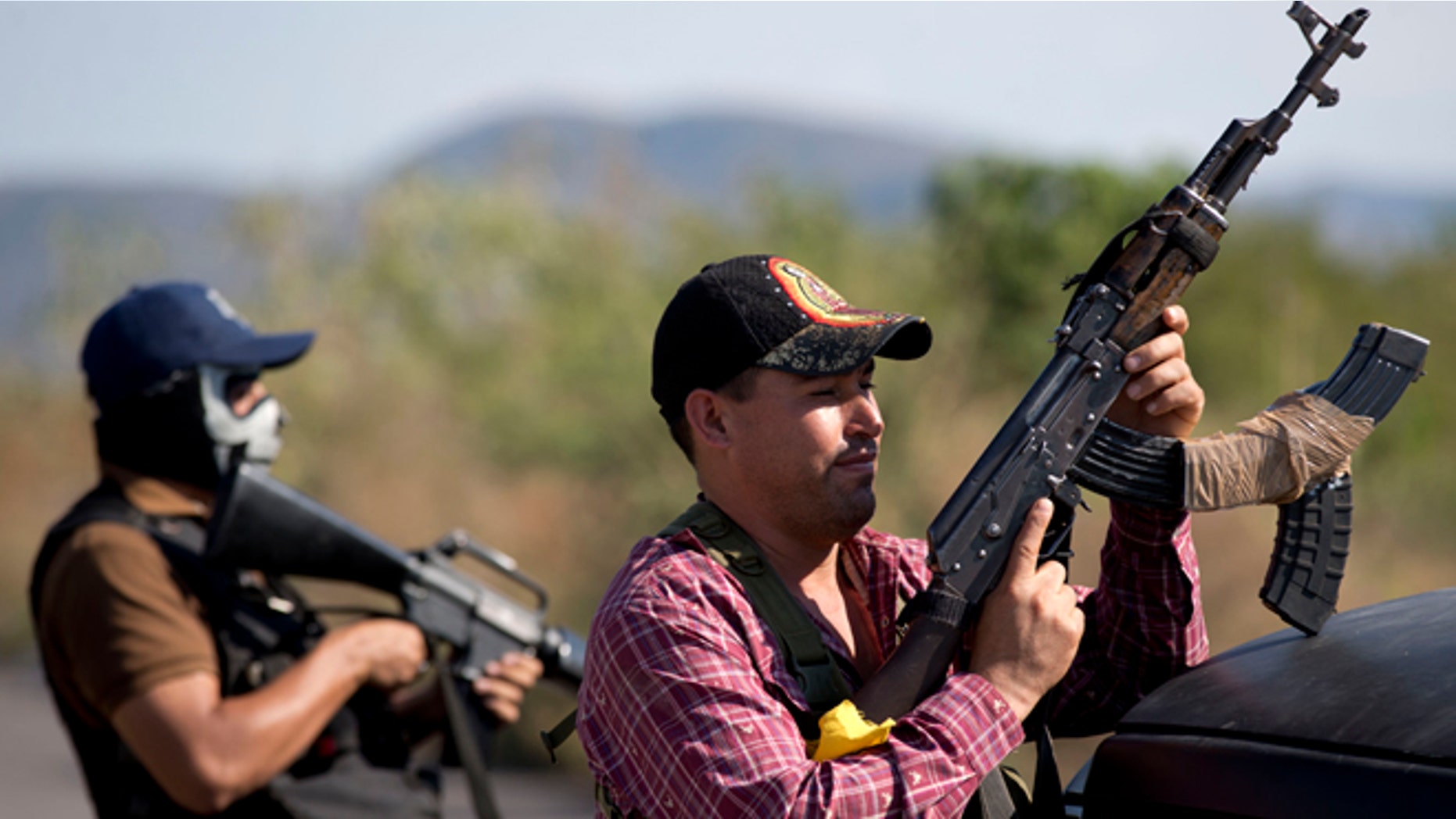 Armed men from the Self-Defense Council of Michoacán at the entrance of Antúnez, Mexico, Jan. 14, 2014.