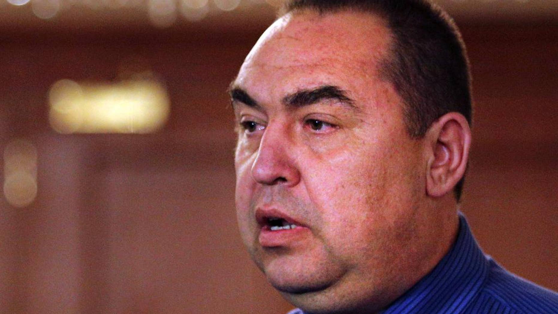 FILE - In this Friday, Sept. 5, 2014 file photo, Igor Plotnitsky, the leader of pro-Russian rebels in the Luhansk region, speaks to the media after talks on cease-fire in Ukraine in Minsk, Belarus. Pro-Russian rebels in Ukraine's separatist region of Luhansk say Plotnitsky has been wounded in a car bombing, taken to hospital and is now in a stable condition. The rebel-run Luhansk Information Center says an unidentified explosive device went off near the car of the leader of the self-proclaimed Luhansk People's republic in Luhansk early morning Saturday, Aug. 6, 2016. (AP Photo, file)