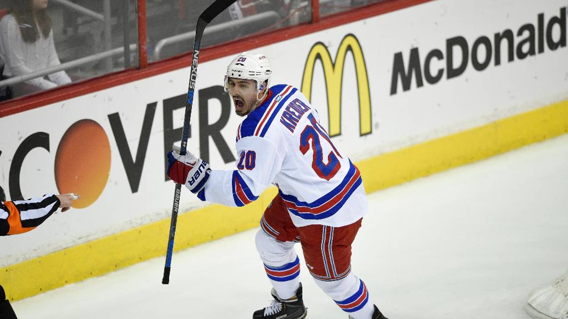 New York Rangers defenseman Dan Girardi (5) battles for the puck against Washington Capitals left wing Alex Ovechkin (8), from Russia, during the first period of Game 6 in the second round of the NHL Stanley Cup hockey playoffs, Sunday, May 10, 2015, in Washington. (AP Photo/Nick Wass)
