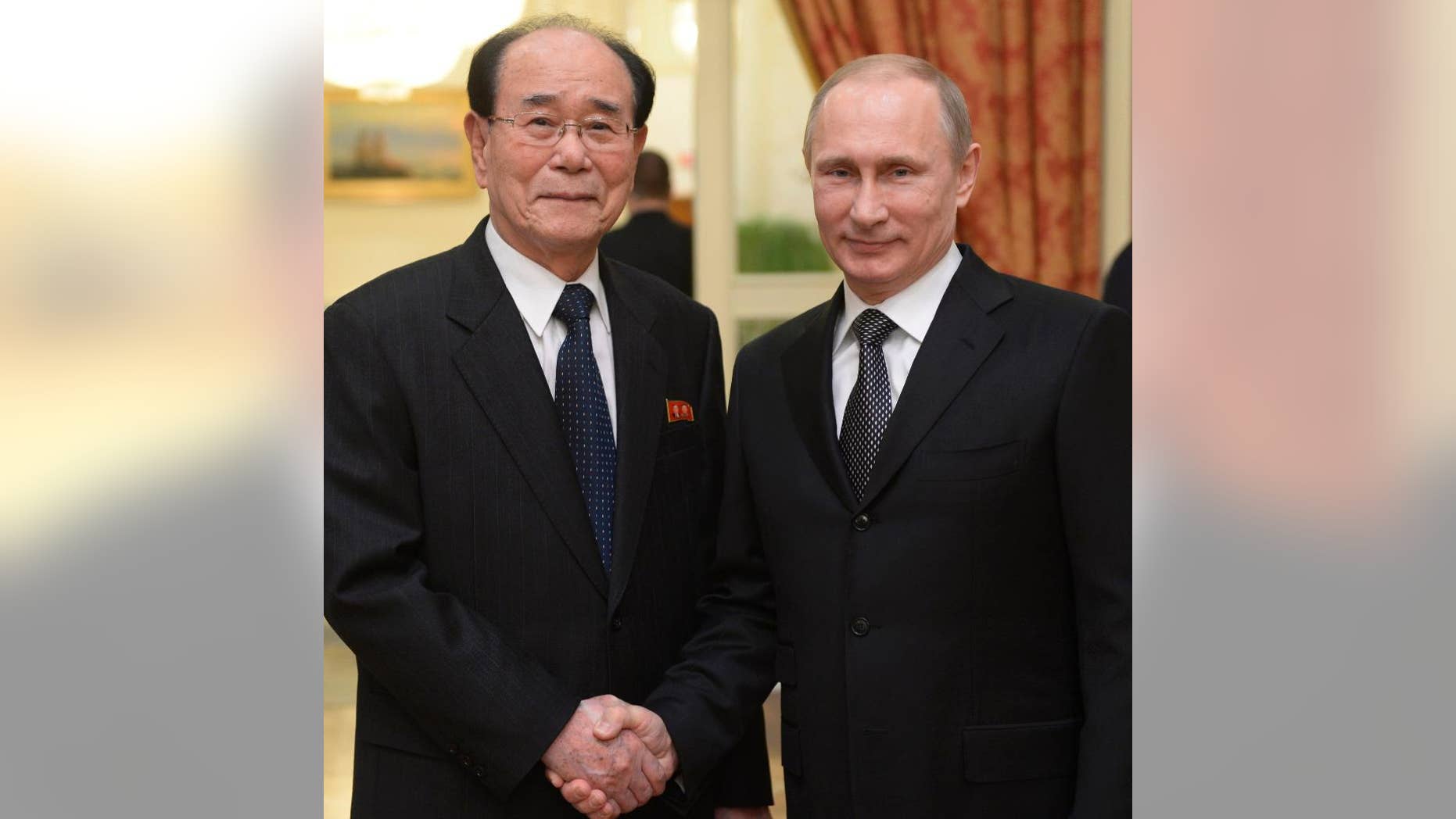 Russian President Vladmir Putin with the president of the Presidium of North Korea's Supreme People's Assembly Kim Yong Nam.