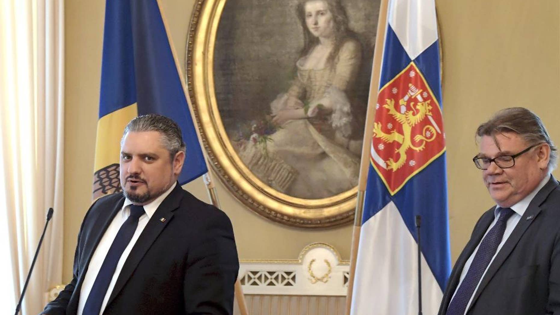 Moldovan Foreign Minister, Andrei Galbur, left, and his Finnish counterpart Timo Soini take part in a joint press conference in Helsinki, Finland, Monday, March, 13, 2017. (Markku Ulander/Lehtikuva via AP)