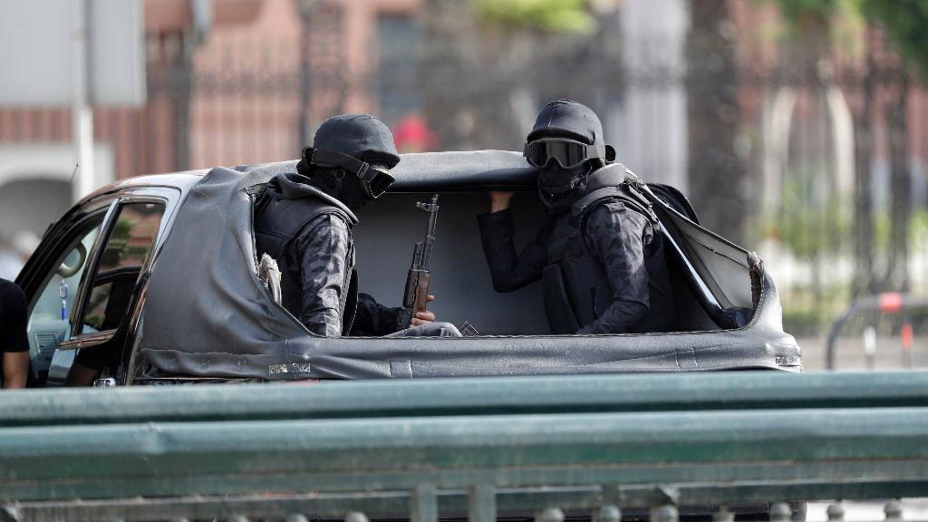 Security forces patrol the area where Pope Francis will celebrate Mass for Egypt's tiny Catholic community, in Cairo, Saturday, April 29, 2017. Pope Francis came to Egypt on Friday for a historic visit to the Arab and Muslim majority nation aimed at presenting a united Christian-Muslim front to repudiate violence committed in God's name. (AP Photo/Gregorio Borgia)