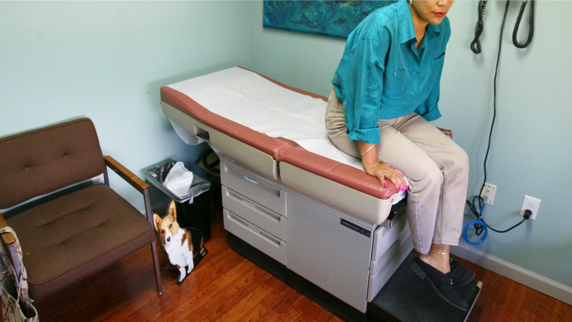 MIAMI - JULY 12: Alba Cerrato waits during a regularly scheduled checkup with her doctor at Mercy Hospital July 12, 2002 in Miami, Florida. Cerrato contracted AIDS in 1994 from her boyfriend who passed away in 1999. Centers for Disease Control and Prevention (CDC) researchers have warned that HIV infection rates among women were on the rise. HIV-positive women of childbearing age between13 to 44 , soared from 80,000 to 135,000 from 1991 to 2000 in the U.S. The latest data from the CDC show that in 2000, three of the top four metropolitan areas in the country for the number of new AIDS cases are among people aged 18 to 29 with Miami ranking first, Fort Lauderdale third and West Palm Beach fourth. The annual international conference on HIV/AIDS conference continues this week in Barcelona, Spain. (Photo by Joe Raedle/Getty Images)