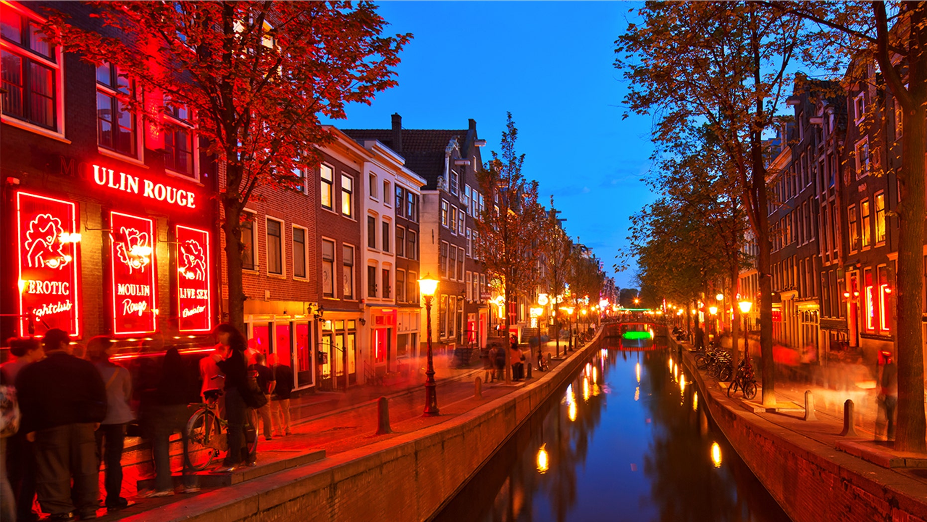 Don't get caught peeping on hookers in Amsterdam display windows or you might get fined.