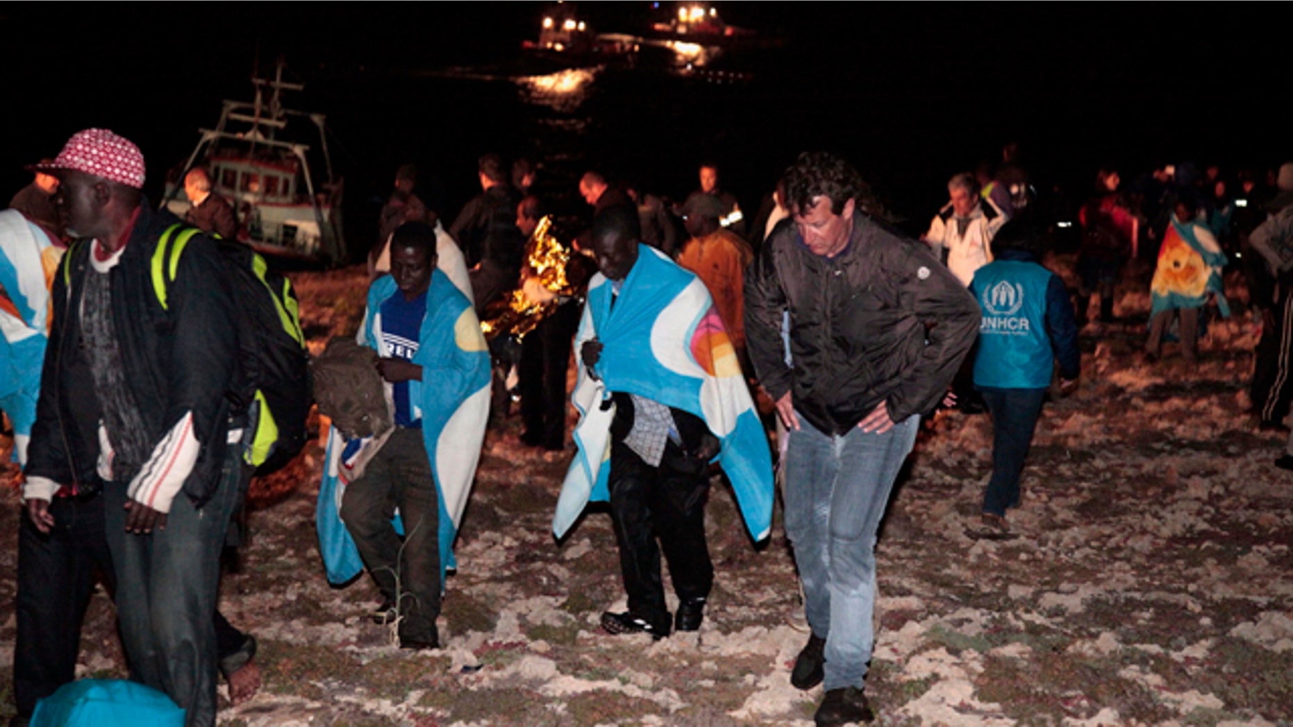May 8: Migrants arrive on the tiny island of Lampedusa, Italy.