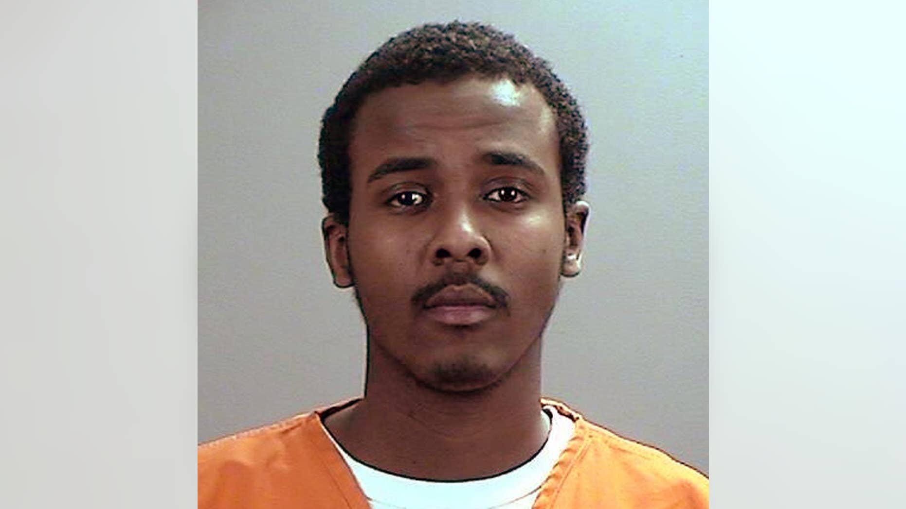This undated photo provided the Sherburne County, Minn., Sheriff’s Office shows Abdirahman Yasin Daud, one of several Minnesota men accused of conspiring to travel to Syria to join the Islamic State group. Court documents filed Thursday, May 21, 2015, by prosecutors said Daud told friends he’d “spit on America" at the U.S.-Mexico border. (Sherburne County Sheriff’s Office via AP)