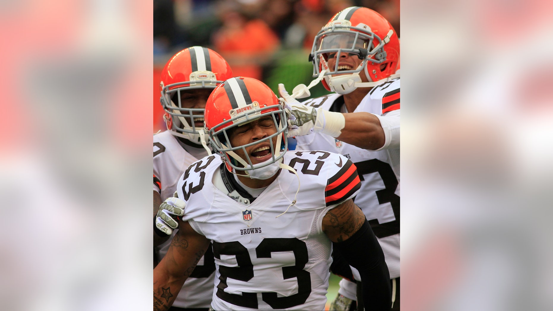 FILE - In this Nov. 17, 2013 file photo, Cleveland Browns cornerback Joe Haden (23) celebrates after scoring a touchdown on an interception in the first half of an NFL football game against the Cincinnati Bengals in Cincinnati. Haden, playing the best football of his life, credits his growth as a player to his four-game suspension last season and his maturity to getting married earlier this year. (AP Photo/Tom Uhlman)