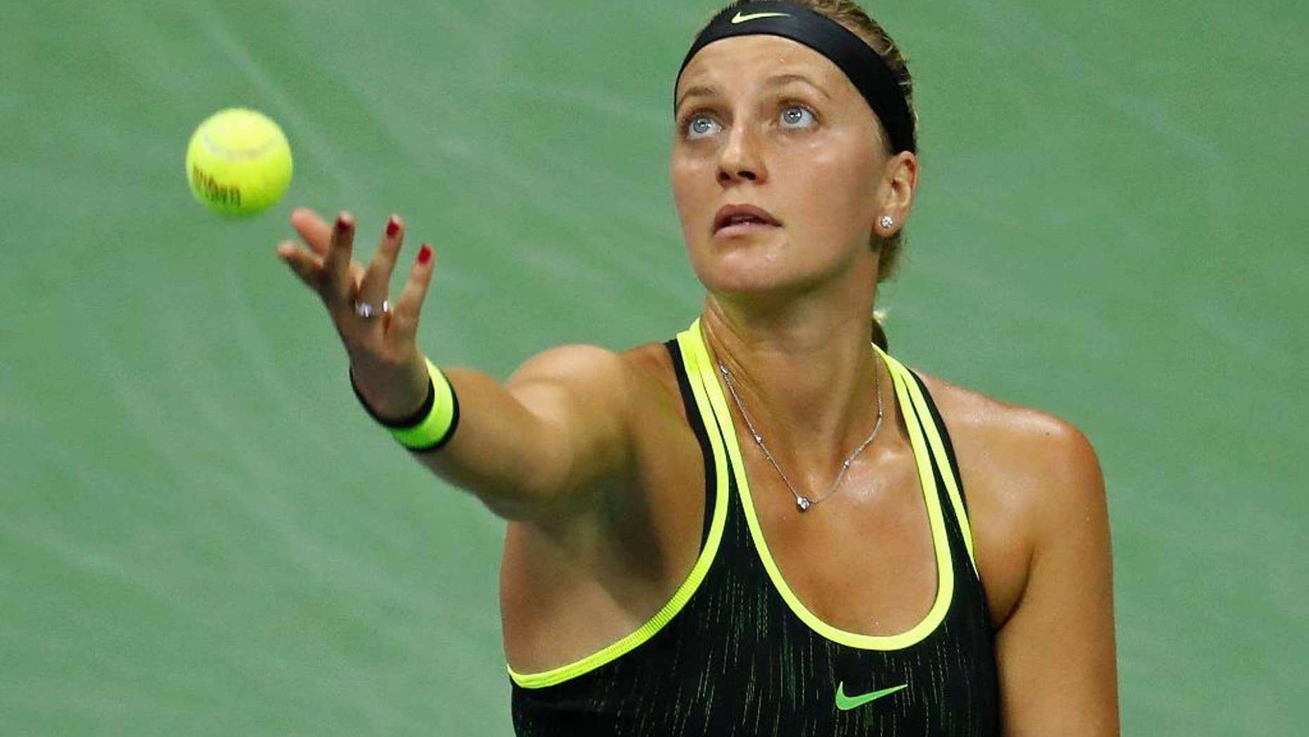 Petra Kvitova, of the Czech Republic, serves to Angelique Kerber, of Germany, during the fourth round of the U.S. Open tennis tournament, Sunday, Sept. 4, 2016, in New York. (AP Photo/Adam Hunger)