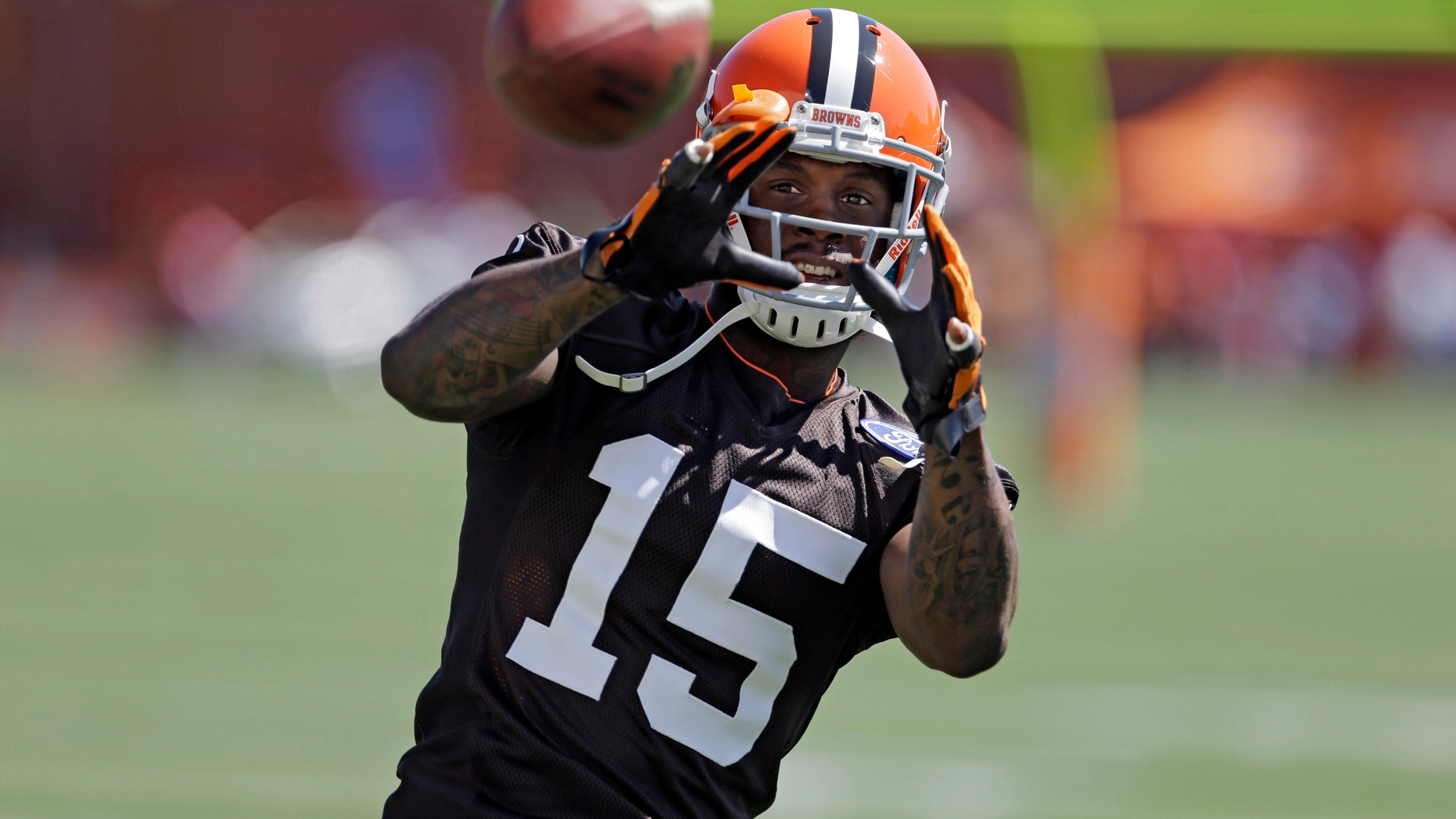 FILE - In this July 25, 2013, file phot, Cleveland Browns wide receiver Davone Bess catches a pss during NFL football training camp at the team's training facility in Berea, Ohio. The Browns say they are aware of potentially incriminating photos posted by wide receiver Davone Bess on his Twitter account. Bess, who missed Cleveland's final two games for personal reasons, posted a photo on Thursday, Jan. 16, 2014, of a small package containing what appears to be marijuana. (AP Photo/Mark Duncan)